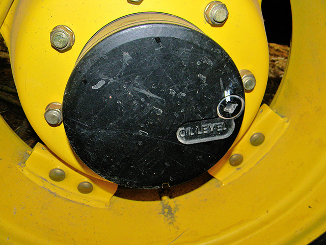 John Deere tractor front wheel drive hydraulic oil drain plug, Image by Steve Thompson